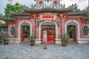 young woman posing in the phuc kien temple in hoi an